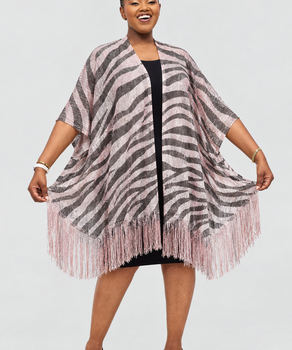 Model wearing the zebra-patterned poncho