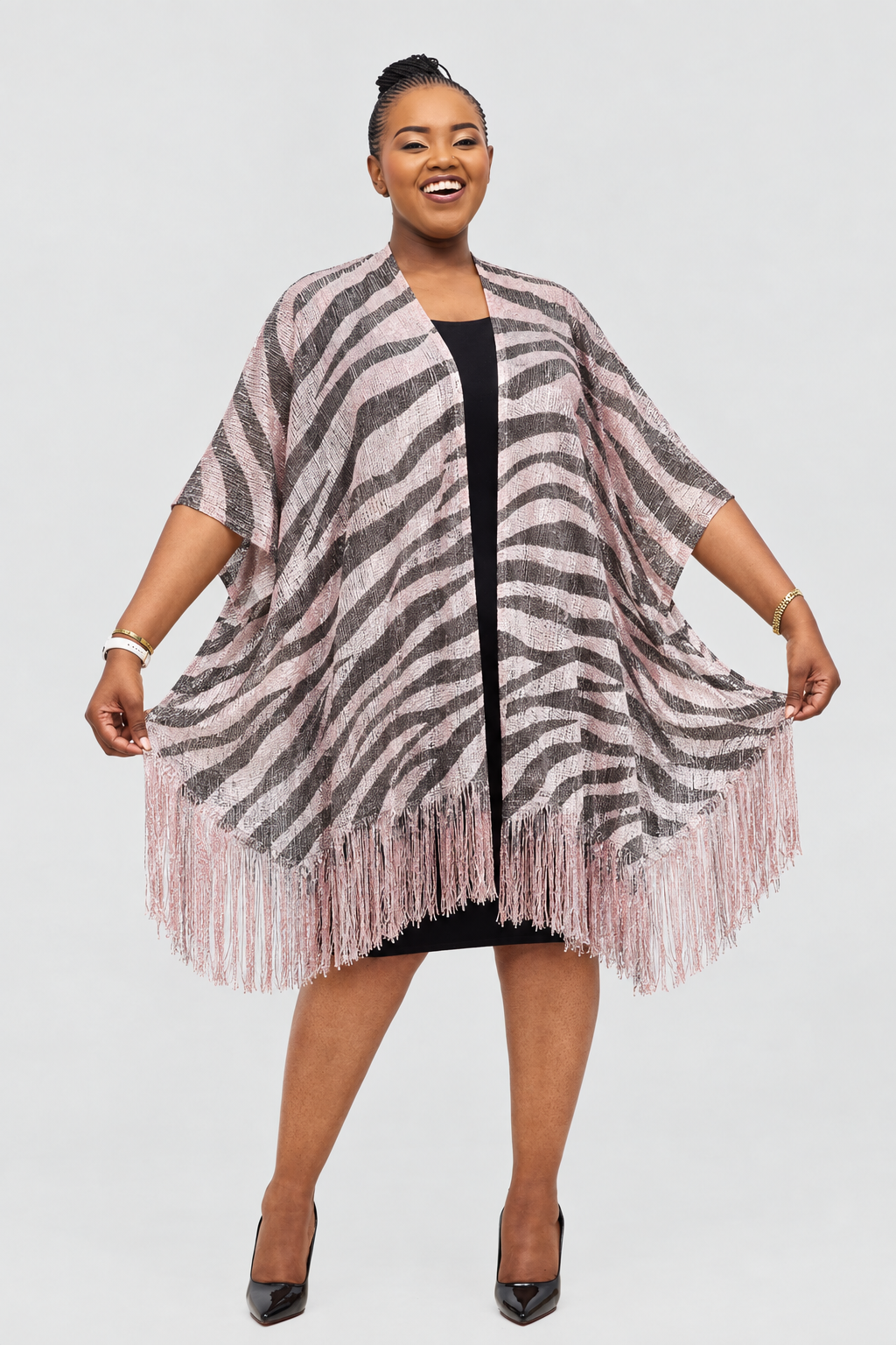 Model wearing the zebra-patterned poncho