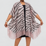 Model wearing the zebra-patterned poncho